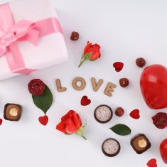 Flat lay composition with Valentine day accessories on white bac