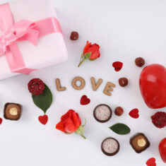 Flat lay composition with Valentine day accessories on white bac