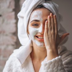 Portrait of a woman with a facial mask half face
