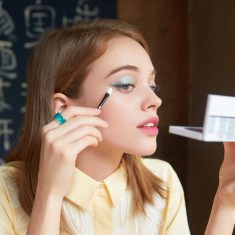 Woman Applying Eye & Lip Beauty Box