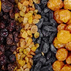 top view of assortment of dried fruits apricots raisins cherries and cherry plums