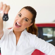 woman holding new car key