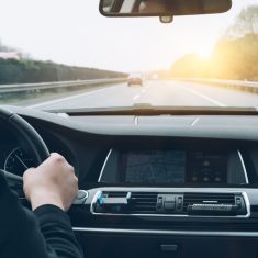 man driving car from rear view