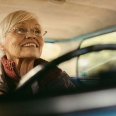 Senior woman carefully driving a car