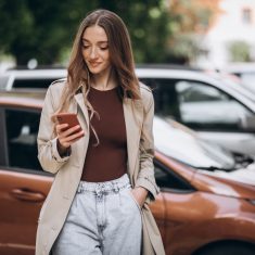 Young woman in the city center with phone