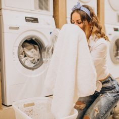 Young pretty woman at a laundrette