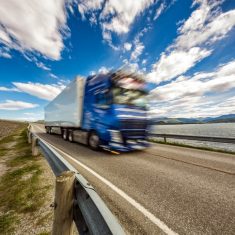 Truck rushes down the highway in the background Atlantic Ocean R
